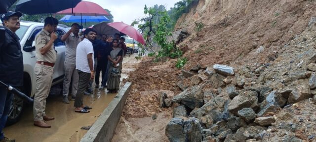 M P - inspects-landslide